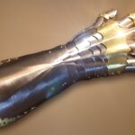 silver and brass gauntlet